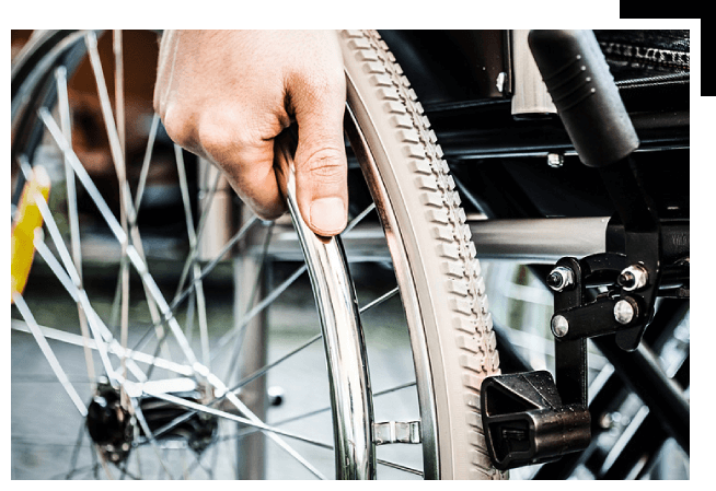 Paralyzed man using his wheelchair